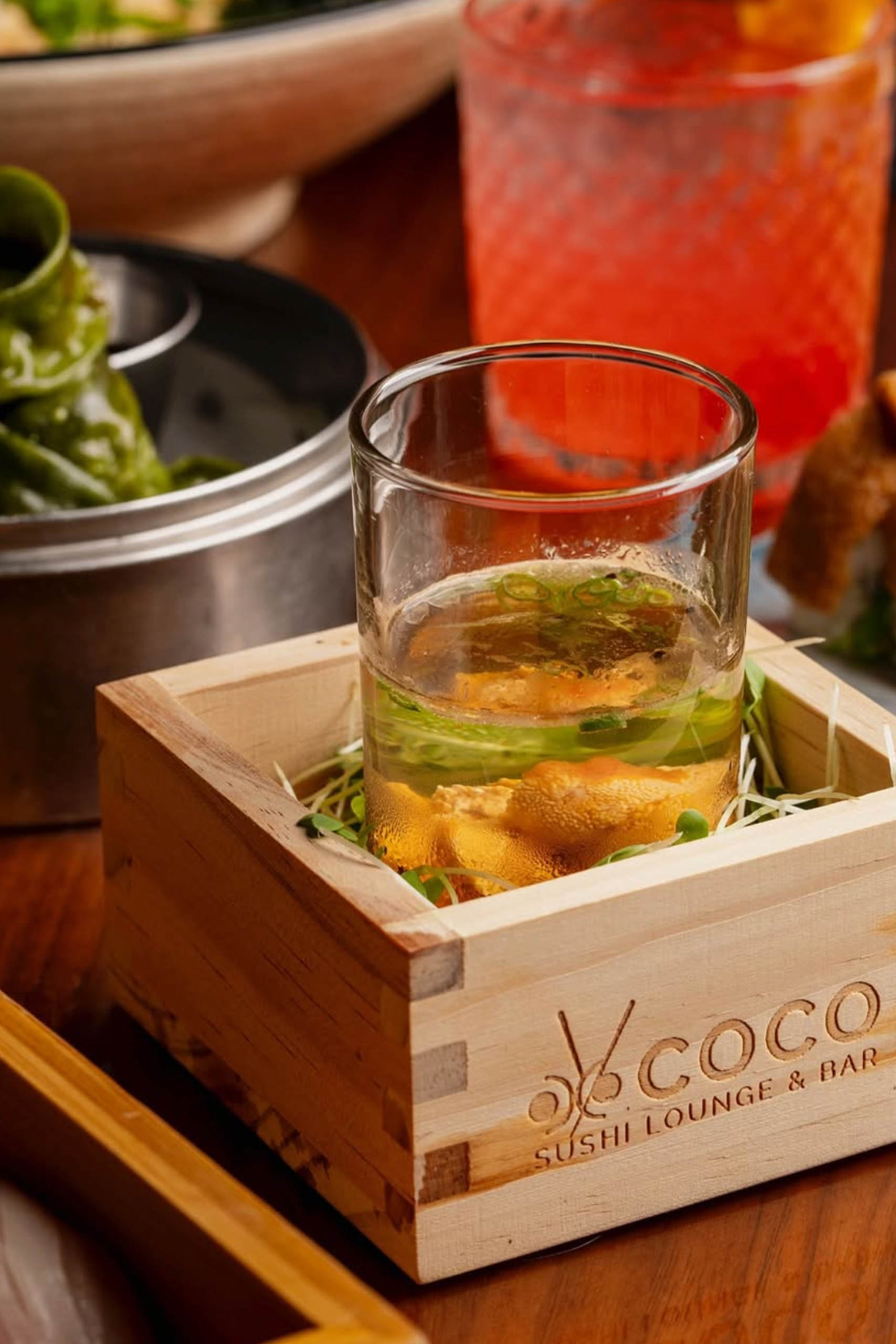 An oyster shot served in a shot glass