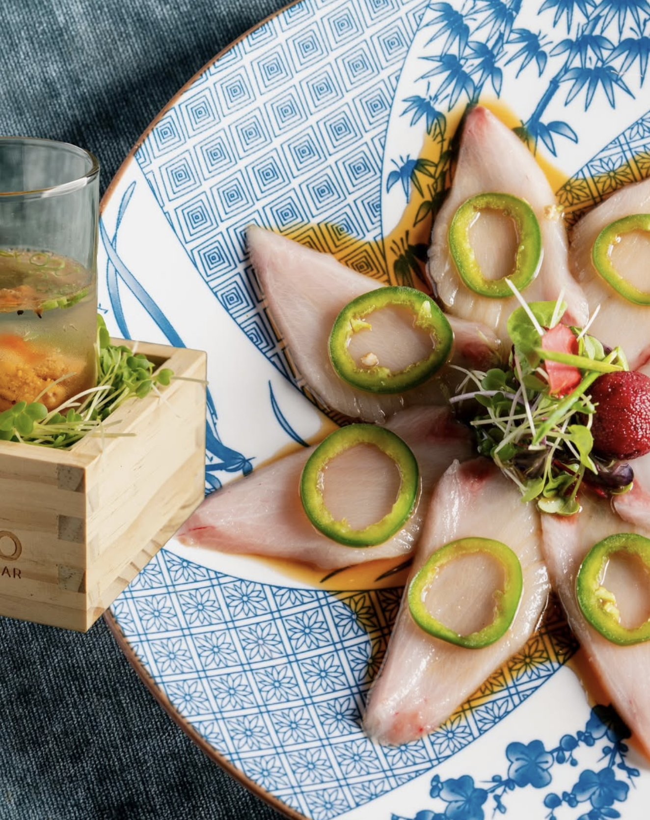 Yellowtail sashimi with jalapeño slices and ponzu sauce